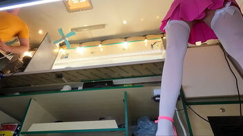 Beautiful 18-year-old woman at work, hidden camera seizes her upskirt shots.