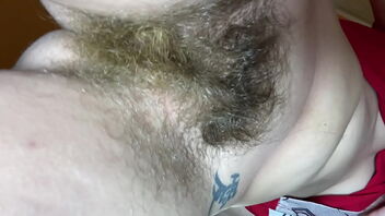 Close up of a hairy pussy bush in a solo homemade video