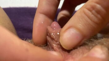 Solo masturbation with extreme close up shots of a puffy and fur covered pussy