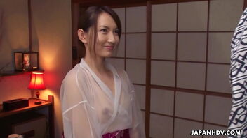 A Japanese woman gives a bj to her paramour in the bathroom.