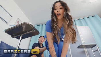 Beautiful nurses Aria Lee and Lulu Chu secretly take a cum sample from Zac in the exam room. BRAZZERS