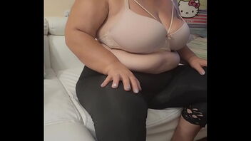 The enigmatic BBW mature woman, a latina MILF, flashes her gigantic ass and exposes her breasts.