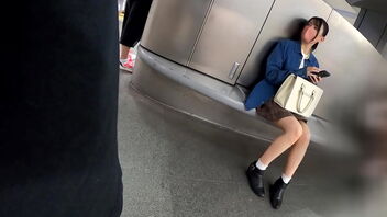 A young woman with black hair walks around Shibuya and shows off her beautiful legs.