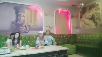 Ultra-kinky group sex in a Chinese KTV bar with a sitting woman and four men