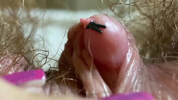 Close up and personal with a big clit, hairy body, and more in this fetish video.