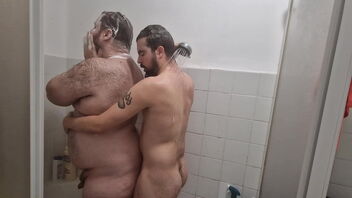 I am an amateur gay and I give a blowjob to a hairy, fat man in the shower.